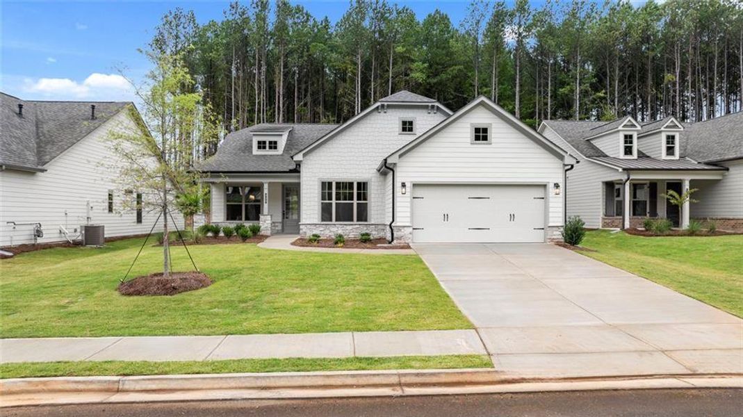 Front exterior of a new home in Soleil Belmont Park, Canton, GA, highlighting curb appeal (Image 1). Front exterior of a new home in Soleil Belmont Park, Canton, GA, highlighting curb appeal (Image 1).