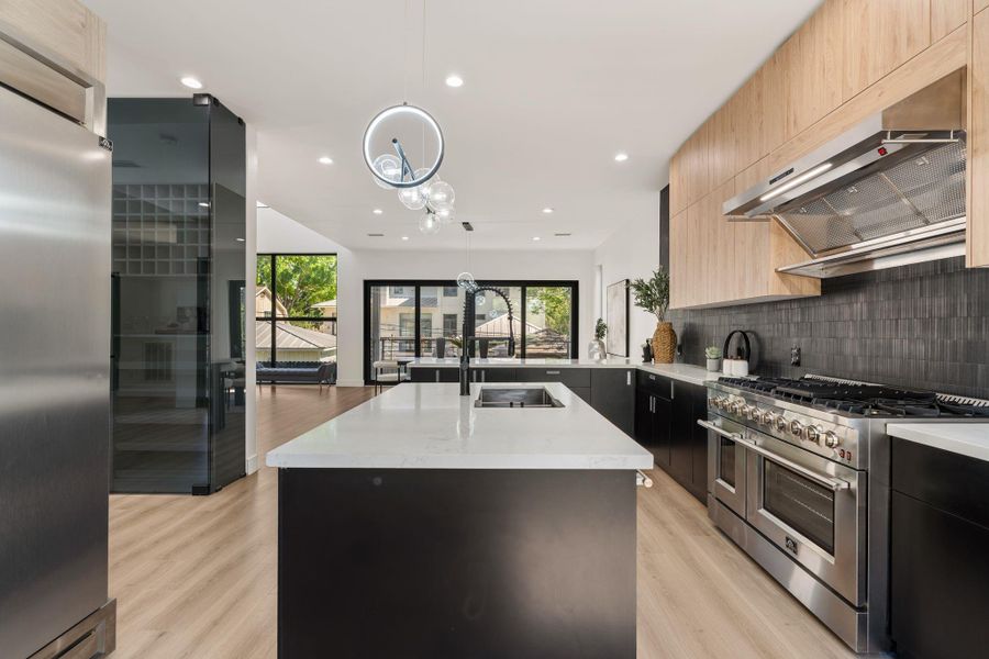 This open concept kitchen is highlighted and the interconnectedness of the space really shines.