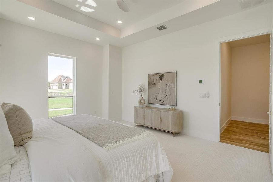 Bedroom with ceiling fan and wood-type flooring