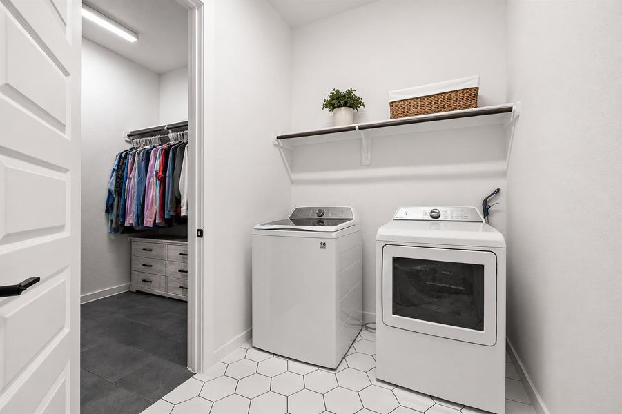 Functional laundry space featuring modern appliances and a convenient, accessible adjacent closet. Functional laundry space featuring modern appliances and a convenient, accessible adjacent closet.