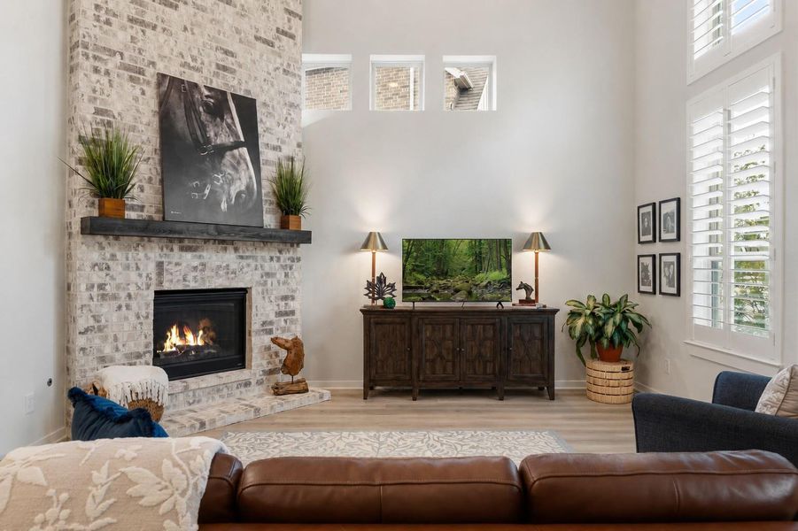 Enjoy the gas log fireplace and floor to ceiling brick fireplace with mantle.