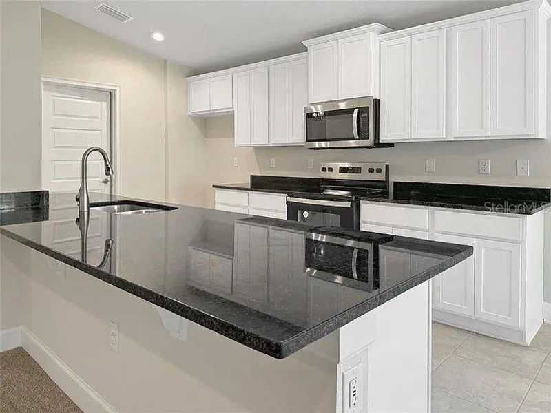 Furnished interior view inside a new home in , Harmony (Image 4).