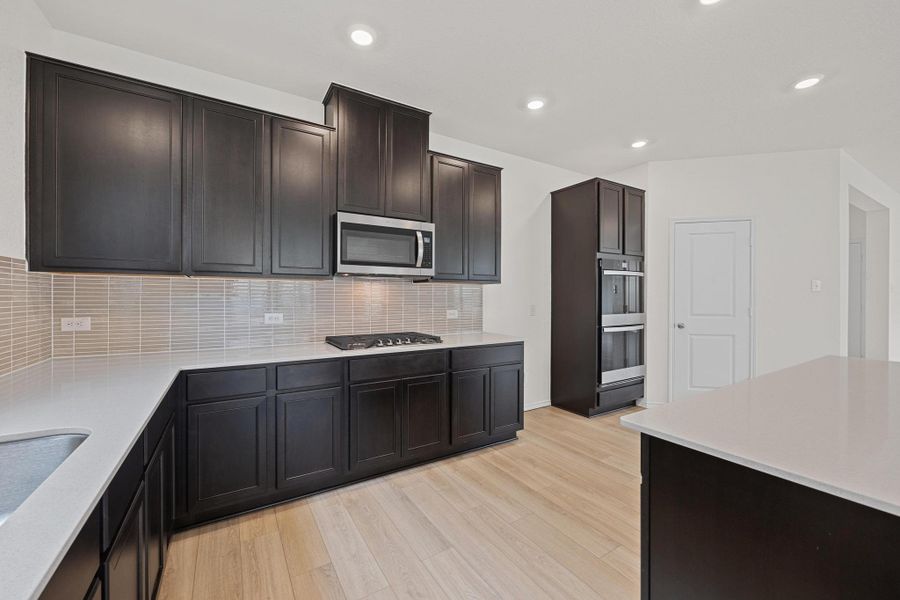 Furnished interior view inside a new home in Salerno - Classic Collection, Round Rock (Image 7). Furnished interior view inside a new home in Salerno - Classic Collection, Round Rock (Image 7).