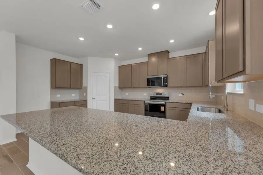 Furnished interior view inside a new home in Mustang Valley, Manor (Image 9).