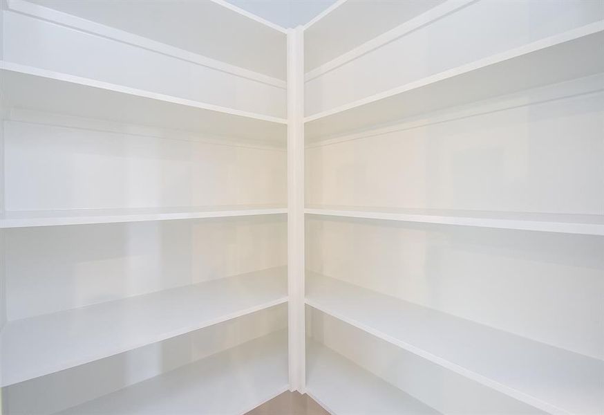 Step into this pantry with ample shelving, perfect for your storage needs. Step into this pantry with ample shelving, perfect for your storage needs.