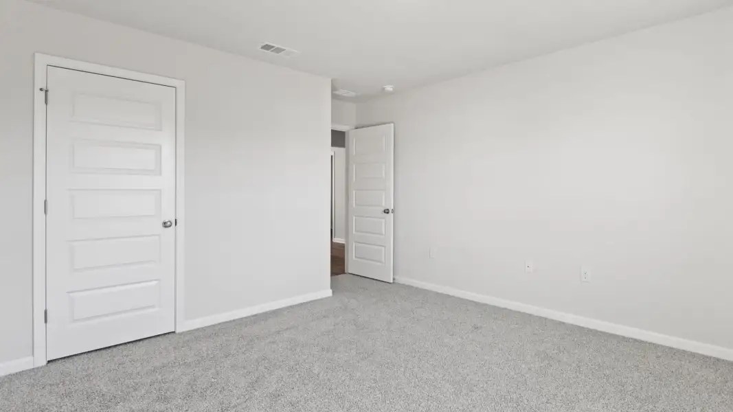 Spacious, unfurnished interior of a new home in Magnolia at the Bluffs Phase 3, Freeport (Image 14).