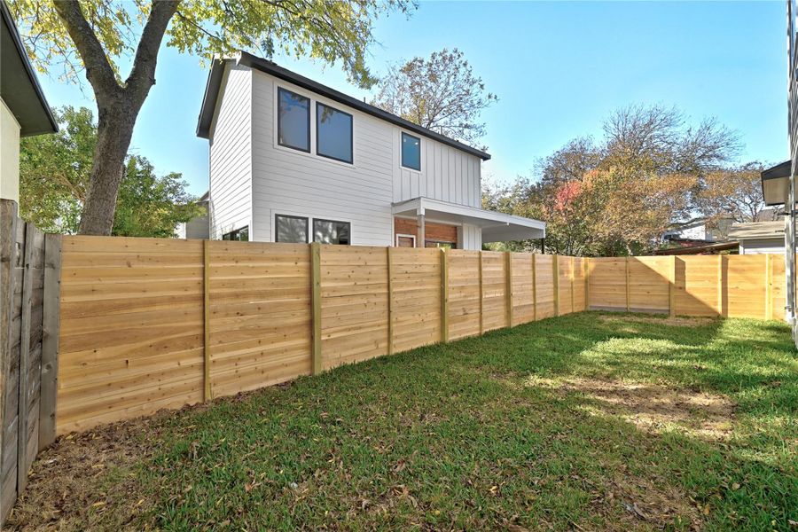 View of fenced backyard