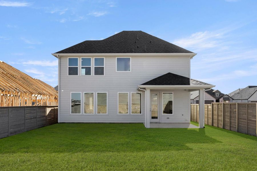 Exterior details and patio area of a home in Treeline, Justin (Image 3).