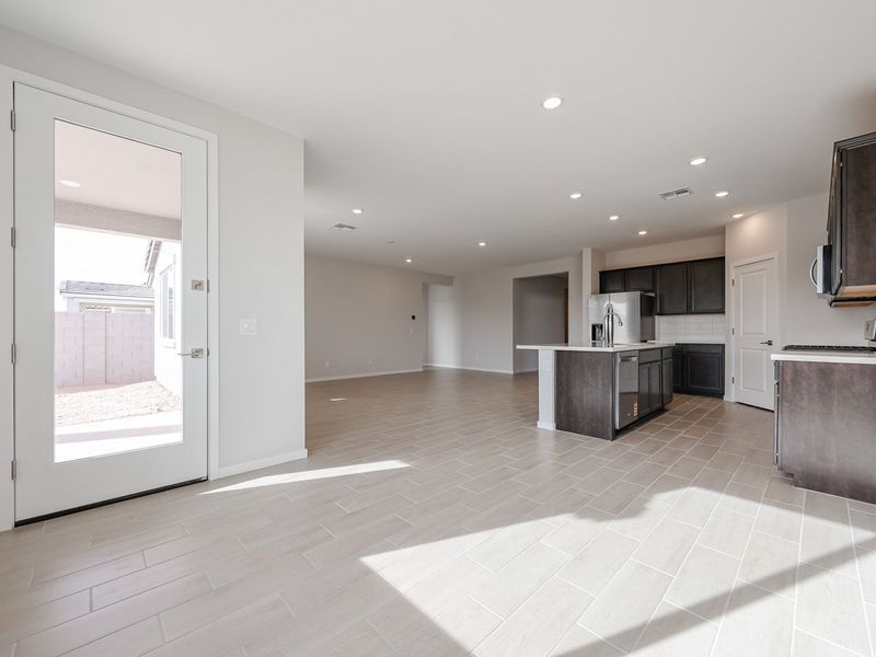 A large kitchen with a glass door. A large kitchen with a glass door.