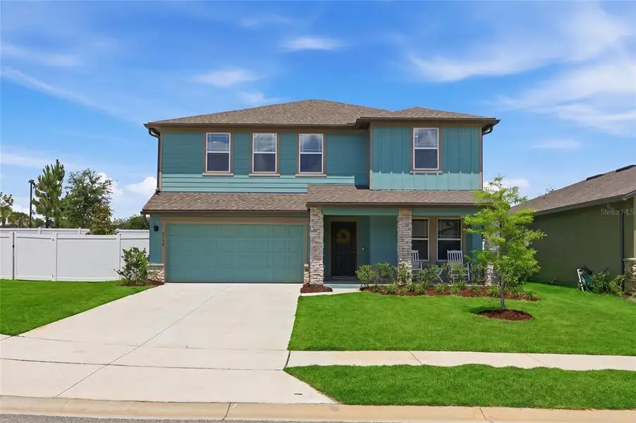 Front exterior of a new home in , Clermont, FL, highlighting curb appeal (Image 24). Front exterior of a new home in , Clermont, FL, highlighting curb appeal (Image 24).