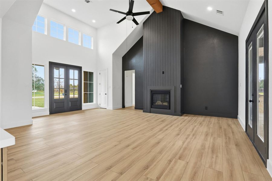 High ceilings and natural light boast the living space. Photos are of prior LOTUS plan homesite built by Aurcova. High ceilings and natural light boast the living space. Photos are of prior LOTUS plan homesite built by Aurcova.