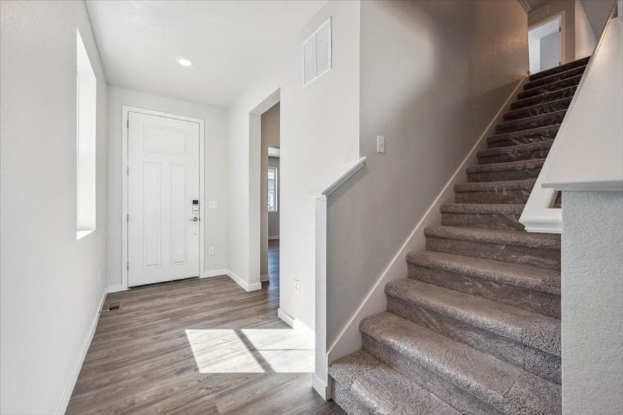 A staircase in a house. A staircase in a house.