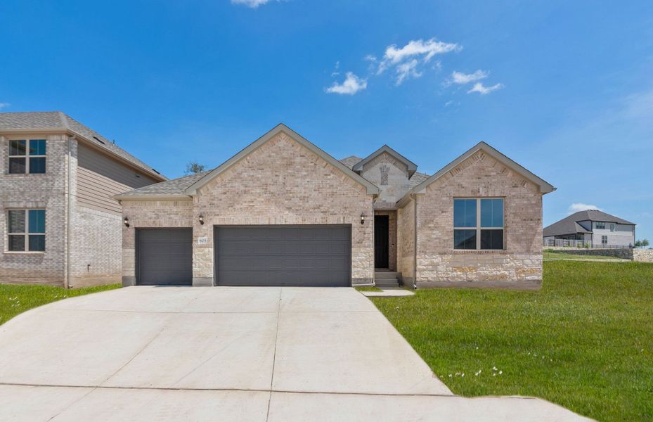 Front exterior of a new home in Crescent Bluff, Georgetown, TX, highlighting curb appeal (Image 24).