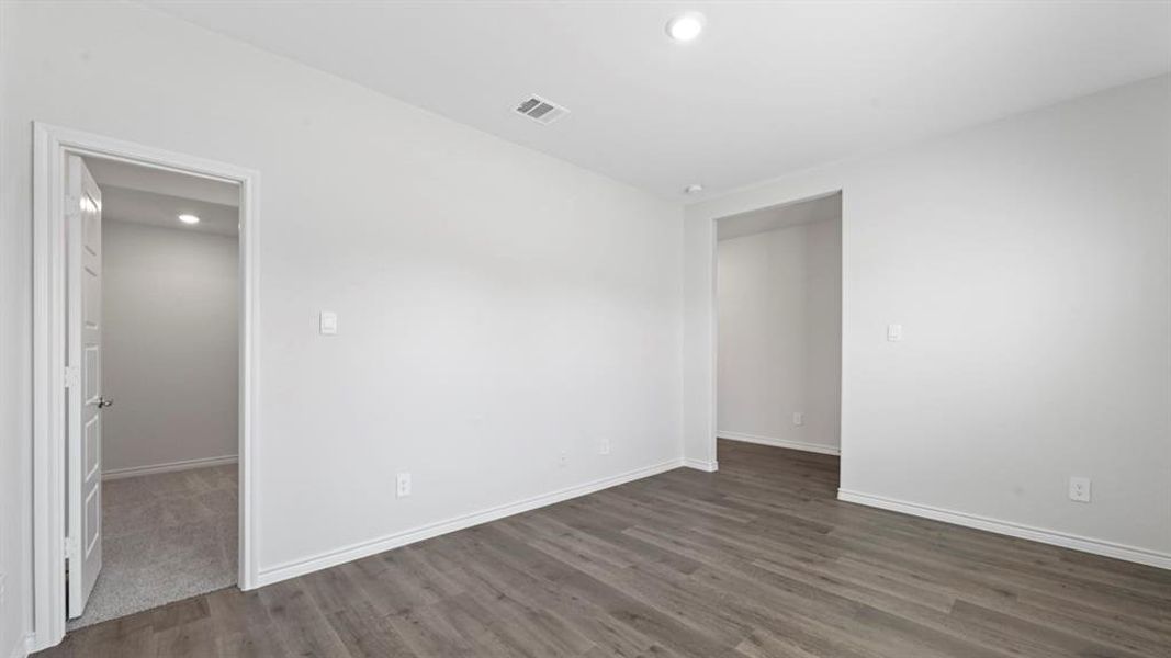 Unfurnished room with recessed lighting and dark wood-type flooring Unfurnished room with recessed lighting and dark wood-type flooring
