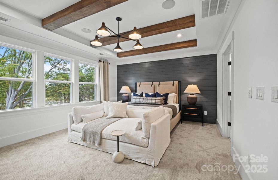 Private owner's suite with beautiful views of private rear yard and neighborhood lake. Representative photo