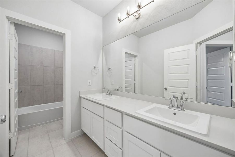 Bathroom in the Winters home plan by Trophy Signature Homes – REPRESENTATIVE PHOTO