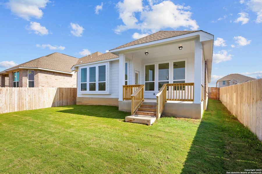 Front exterior of a new home in Sunflower Ridge, New Braunfels, TX, highlighting curb appeal (Image 15). Front exterior of a new home in Sunflower Ridge, New Braunfels, TX, highlighting curb appeal (Image 15).