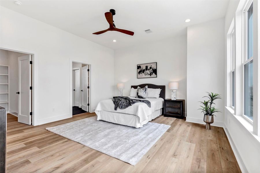 Conveniently located next to the bed, one door leads to the main bath, while the other opens to a spacious walk-in closet – offering both comfort and functionality. Conveniently located next to the bed, one door leads to the main bath, while the other opens to a spacious walk-in closet – offering both comfort and functionality.