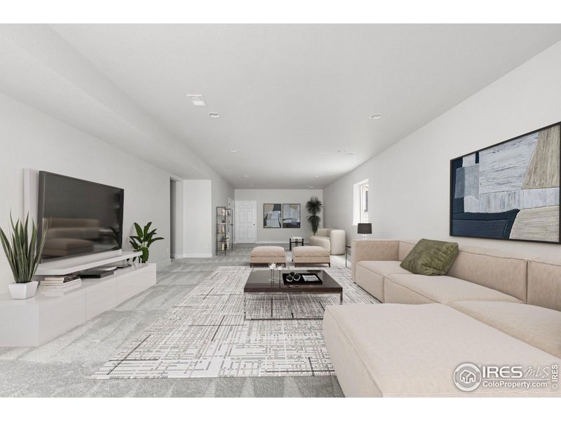 Finished Walk-Out Basement. This photo has been virtually staged to provide visual ideas for how furniture can be arranged in this area of the home.