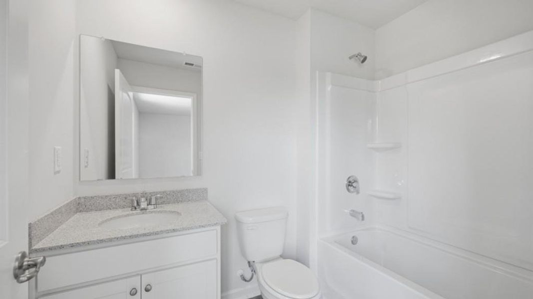Furnished interior view inside a new home in Fairway 17 at Mirror Lake, Villa Rica (Image 11).