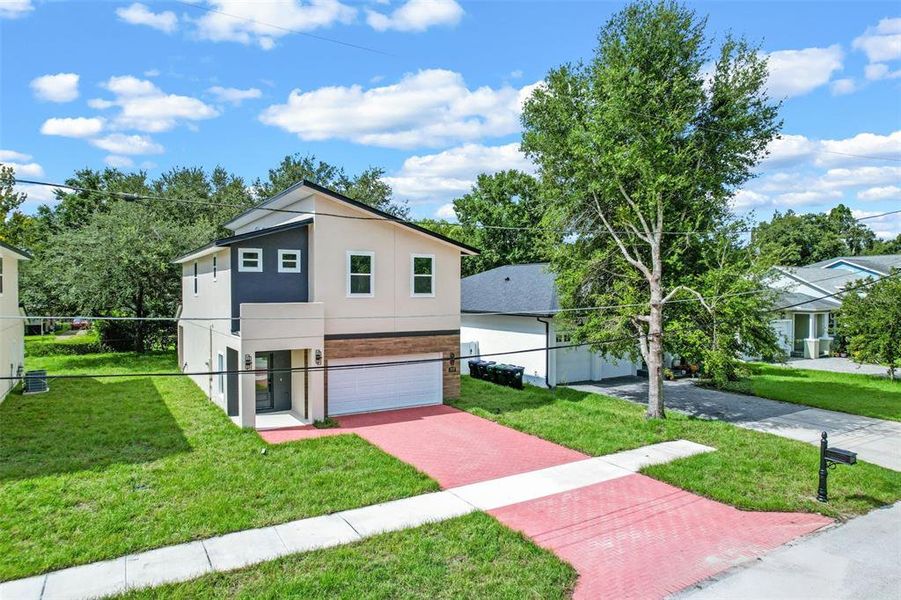 Front exterior of a new home in , Orlando, FL, highlighting curb appeal (Image 29). Front exterior of a new home in , Orlando, FL, highlighting curb appeal (Image 29).