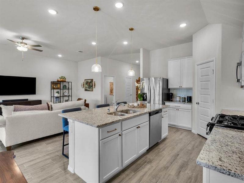This kitchen offers ample counter-top space for creating a culinary masterpiece.