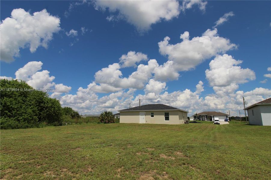 Front exterior of a new home in , Labelle, FL, highlighting curb appeal (Image 1).