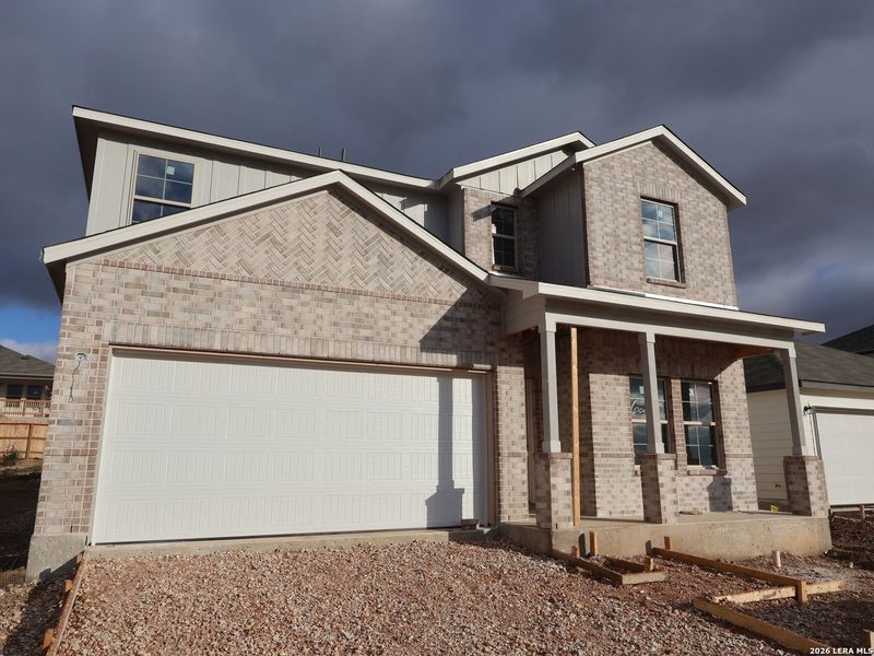 Front exterior of a new home in Mesquite Ridge, San Antonio, TX, highlighting curb appeal (Image 20).