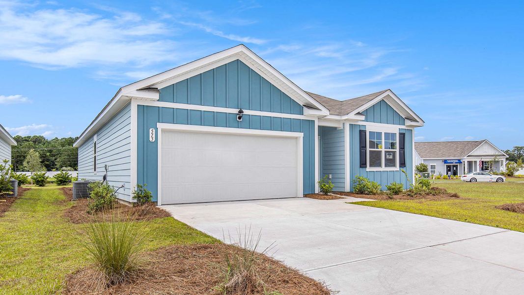 Front exterior of a new home in Auberon Woods, Conway, SC, highlighting curb appeal (Image 2).