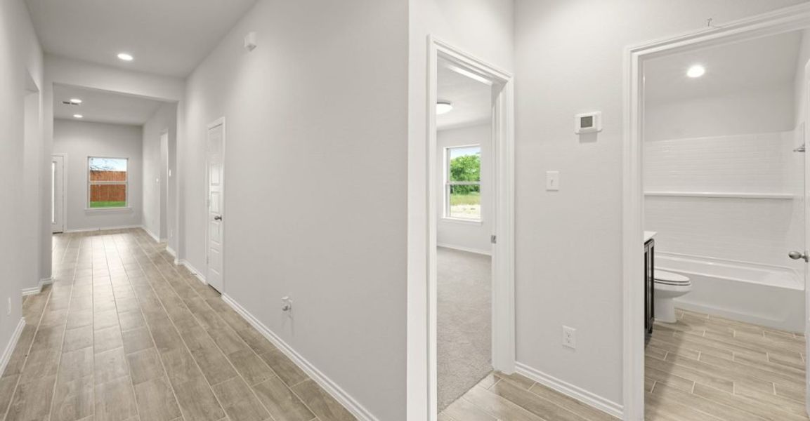 Representative exterior photo of a completed home built from the Boston by Impression Homes in Baker Farms, Cleburne, TX (Image 11).