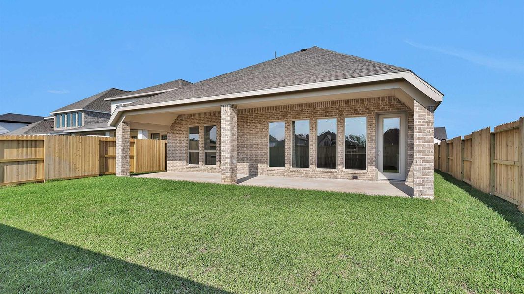 Front exterior of a new home in Sienna 50', Missouri City, TX, highlighting curb appeal (Image 1). Front exterior of a new home in Sienna 50', Missouri City, TX, highlighting curb appeal (Image 1).