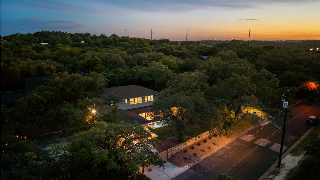 View of subject property featuring a heavily wooded area