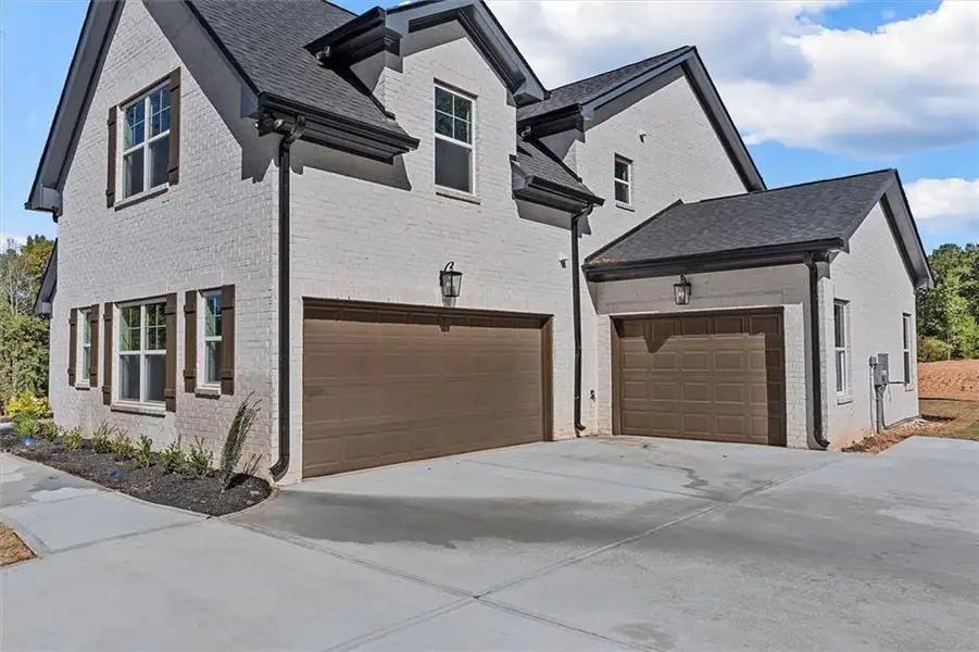 Front exterior of a new home in , Atlanta, GA, highlighting curb appeal (Image 31).