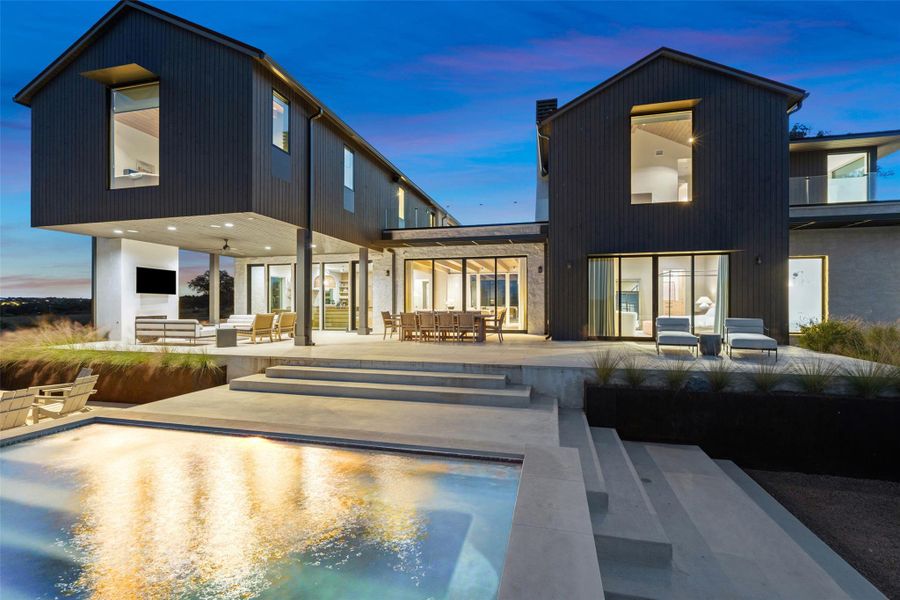 Back of house featuring a patio, outdoor dining area, and an outdoor hangout area
