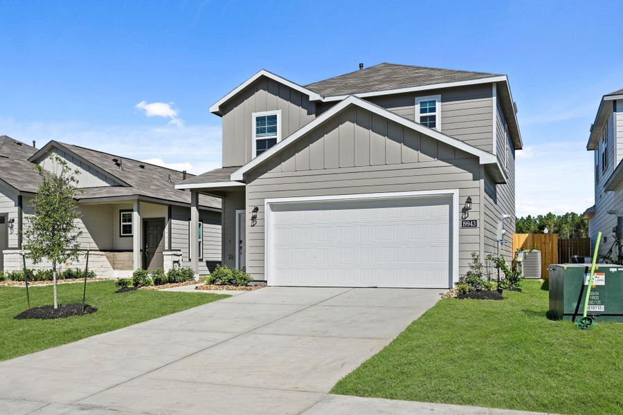 Front exterior of a new home in Northpark South, Porter, TX, highlighting curb appeal (Image 17). Front exterior of a new home in Northpark South, Porter, TX, highlighting curb appeal (Image 17).