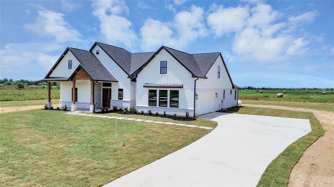 Front exterior of a new home in , Dayton, TX, highlighting curb appeal (Image 26). Front exterior of a new home in , Dayton, TX, highlighting curb appeal (Image 26).