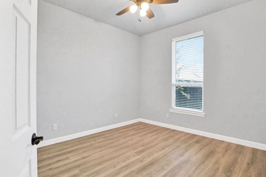 Spare bedroom with ceiling fan and high ceilings!