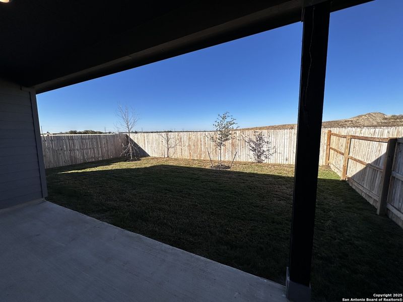 Exterior details and patio area of a home in Hennersby Hollow, San Antonio (Image 3).