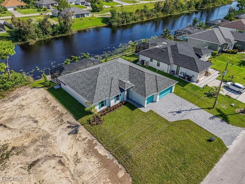 Front exterior of a new home in Cape Coral, Cape Coral, FL, highlighting curb appeal (Image 19).