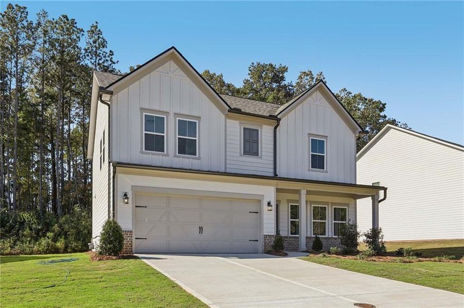 Front exterior of a new home in The Pointe at Heron Bay, Locust Grove, GA, highlighting curb appeal (Image 2).