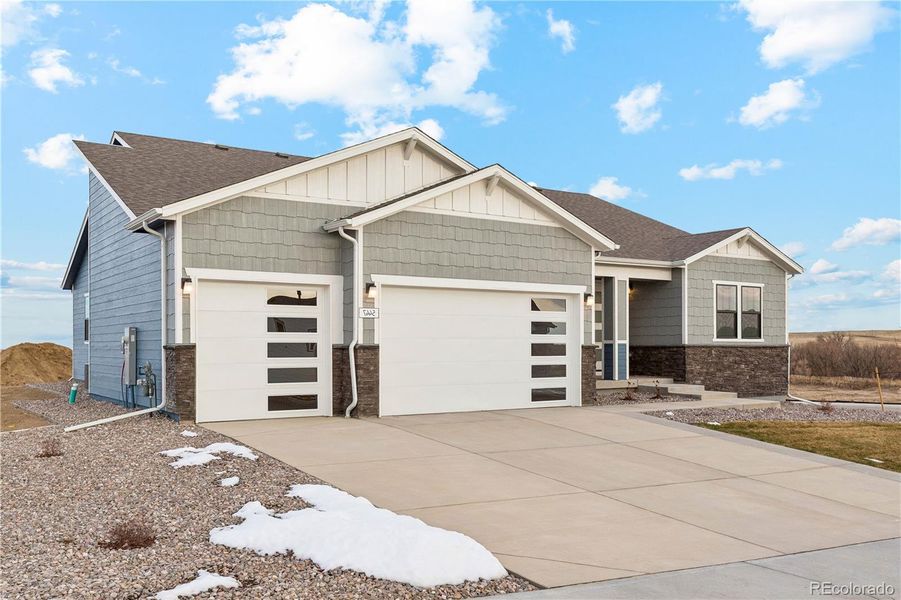 Front exterior of a new home in Spring Valley Ranch, Elizabeth, CO, highlighting curb appeal (Image 18). Front exterior of a new home in Spring Valley Ranch, Elizabeth, CO, highlighting curb appeal (Image 18).