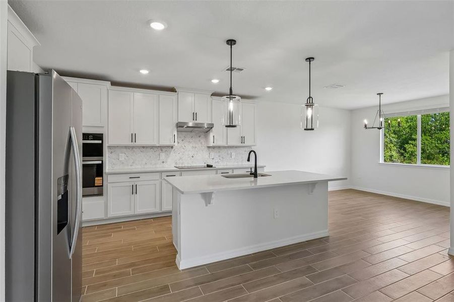 Furnished interior view inside a new home in The Grove at Stuart Crossing - Signature Series, Bartow (Image 10).