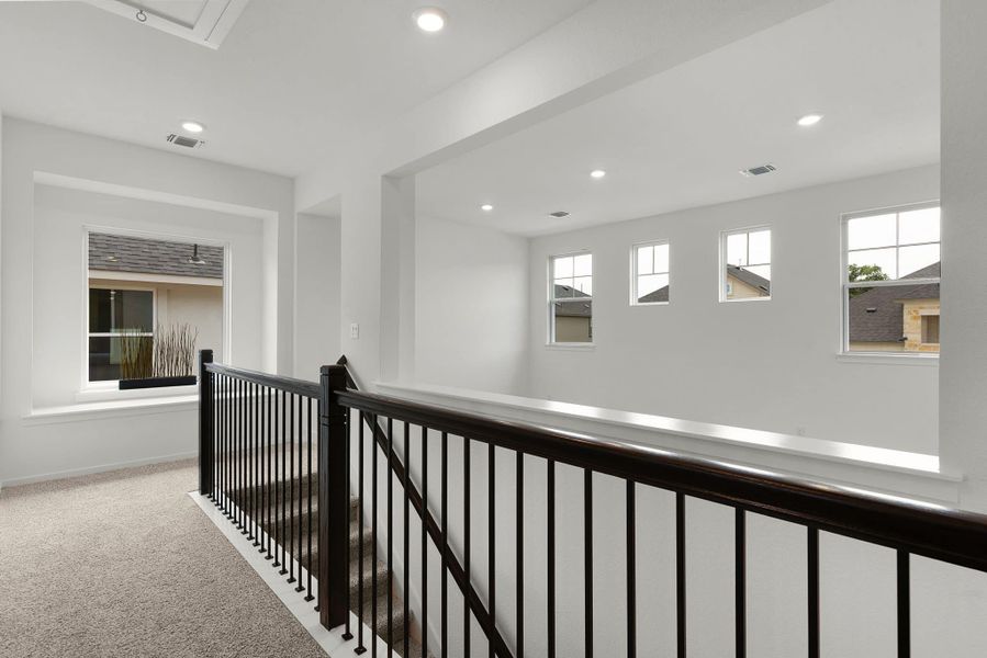 Representative unfurnished interior of a home built from the Maeve by Chesmar Homes in Deerbrooke Cottages, Leander (Image 13).