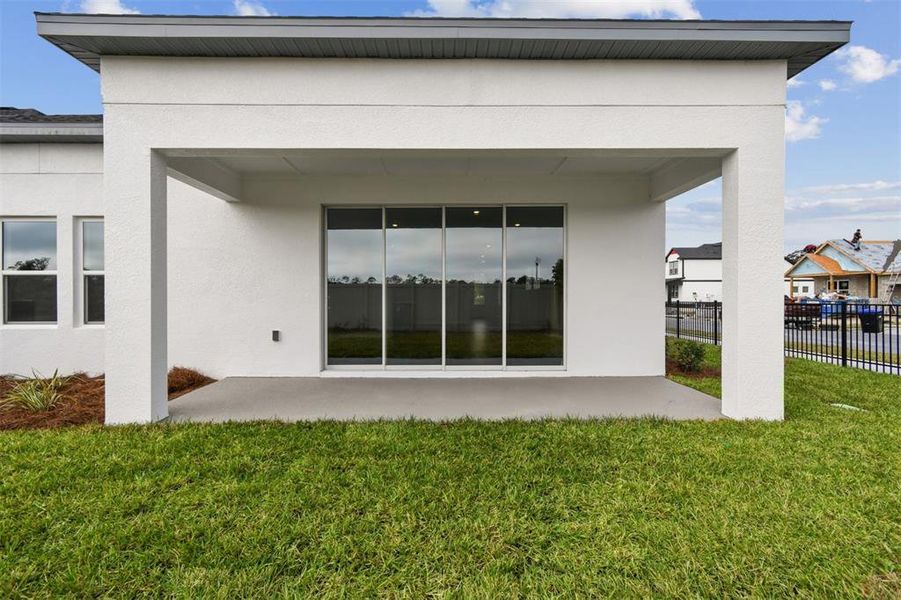 Exterior details and patio area of a home in Oakfield at Mount Dora Village Series, Mount Dora (Image 19).