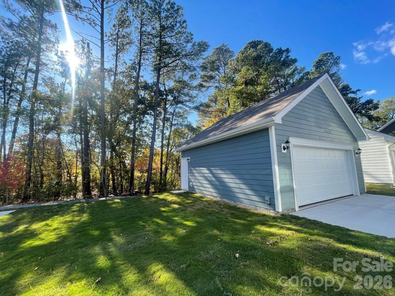 2 Car Rear Detached Garage. Backs to walking trail and trees