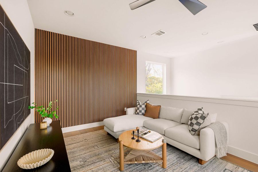 Living room with recessed lighting, wood finished floors, and ceiling fan Living room with recessed lighting, wood finished floors, and ceiling fan