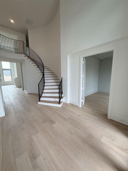 At entry, your greeted by an elegant, curved staircase. Representative photo. At entry, your greeted by an elegant, curved staircase. Representative photo.