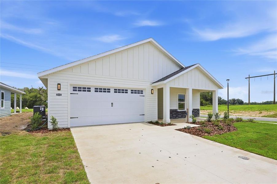 Front exterior of a new home in , Newberry, FL, highlighting curb appeal (Image 18).
