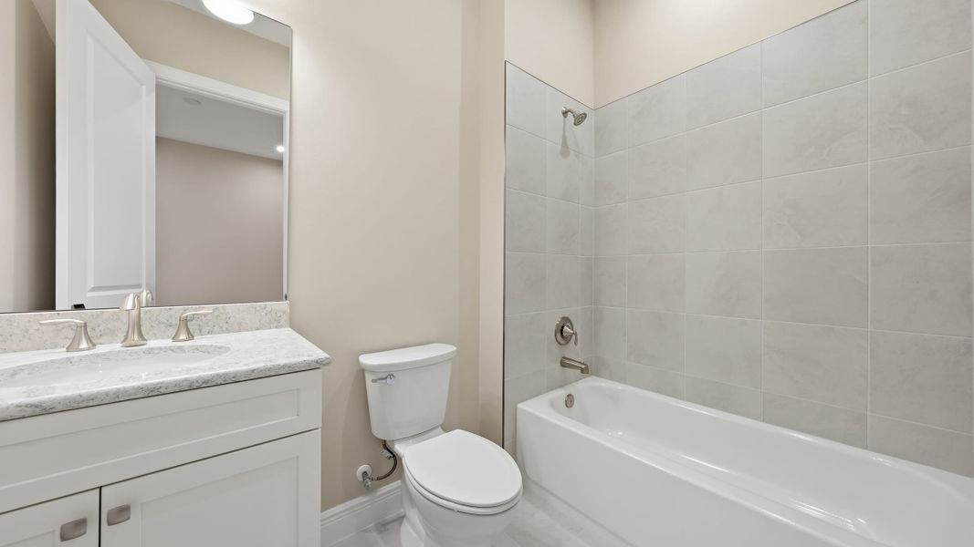 Furnished interior view inside a new home in PGA Village Verano, Port St. Lucie (Image 14).