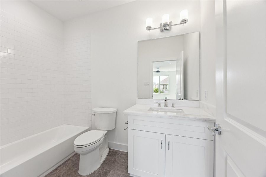 En-Suite Bathroom * Subway Tile * Porcelain Floor * Marble Counter. En-Suite Bathroom * Subway Tile * Porcelain Floor * Marble Counter.